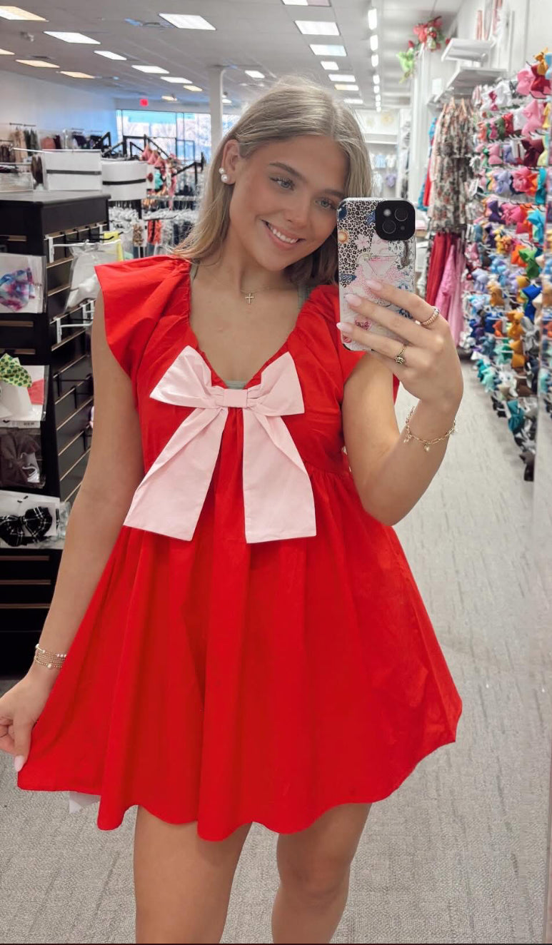 Red dress, pink bow